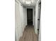 Hallway featuring recessed lighting, wood-look floors, and neutral walls at 8029 Cedar Glen Dr, Charlotte, NC 28212