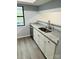 Kitchenette area with a granite countertop, neutral cabinets, and stainless steel appliances at 8029 Cedar Glen Dr, Charlotte, NC 28212