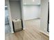 Open living space with wood-look floors, and a view into other rooms at 8029 Cedar Glen Dr, Charlotte, NC 28212