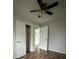 Neutral bedroom featuring wood-look flooring, closet, and a modern ceiling fan at 843 Spring St, Rock Hill, SC 29730