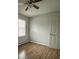 Cozy bedroom with a ceiling fan, window, and modern flooring, ready for comfort at 843 Spring St, Rock Hill, SC 29730