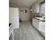 This kitchen features white cabinets, modern appliances, and lots of natural light at 843 Spring St, Rock Hill, SC 29730