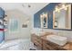 Stylish bathroom with double vanity, vessel sinks, decorative mirrors, walk-in shower, and unique tile floor at 8605 Tamarron Dr, Charlotte, NC 28277