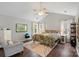 Bright bedroom features vaulted ceilings, ceiling fan, and a reading nook at 8605 Tamarron Dr, Charlotte, NC 28277