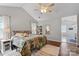Comfortable bedroom with vaulted ceilings, ceiling fan, and ensuite bathroom at 8605 Tamarron Dr, Charlotte, NC 28277