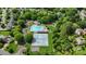 Aerial view of the community pool, clubhouse, tennis courts, playground, parking and green spaces at 8605 Tamarron Dr, Charlotte, NC 28277