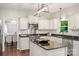 Well-appointed kitchen featuring white cabinetry, granite countertops, and stainless steel appliances at 8605 Tamarron Dr, Charlotte, NC 28277