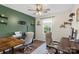 Spacious office with dual desks, a ceiling fan, and a bright window for natural light at 8605 Tamarron Dr, Charlotte, NC 28277