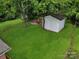 Spacious backyard with a shed and fire pit area, offering plenty of room for outdoor activities and relaxation at 906 Eastwood Dr, Rock Hill, SC 29730