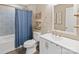 Clean bathroom featuring blue-patterned shower curtain, white vanity, and modern fixtures at 906 Eastwood Dr, Rock Hill, SC 29730