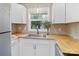 Bright kitchen featuring modern white cabinets, stainless steel sink, and stylish countertops at 906 Eastwood Dr, Rock Hill, SC 29730