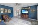 Comfortable living room showcasing a large TV, decor, and access to dining area at 906 Eastwood Dr, Rock Hill, SC 29730