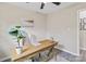 Neutral home office featuring a large wood desk, comfortable chair and simple decor at 906 Eastwood Dr, Rock Hill, SC 29730