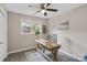 Bright home office featuring a large window, wood desk, and a comfortable chair at 906 Eastwood Dr, Rock Hill, SC 29730