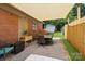 Outdoor patio featuring a dining table, gravel ground cover, and a shade covering at 906 Eastwood Dr, Rock Hill, SC 29730