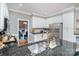 Stylish kitchen with stainless steel appliances, granite countertops and a view of the dining room at 915 Waterview Ln, Monroe, NC 28110