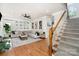 Spacious living room featuring hardwood floors, a cozy sofa, and a stylish decor at 915 Waterview Ln, Monroe, NC 28110