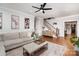 Bright living room featuring hardwood floors, a cozy sofa, and stylish decor at 915 Waterview Ln, Monroe, NC 28110
