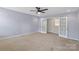 This simple empty bedroom has carpet and a small closet at 9230 Loch Glen Way, Charlotte, NC 28278