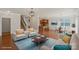 Comfortable living room with ample seating, wood floors, and an open floor plan at 9230 Loch Glen Way, Charlotte, NC 28278