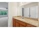 Granite counters in this spacious main bathroom with double-door linen closet at 9230 Loch Glen Way, Charlotte, NC 28278