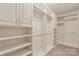 Custom walk-in closet with ample shelving and storage space to keep your wardrobe organized at 9230 Loch Glen Way, Charlotte, NC 28278