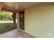 Back porch area, with a concrete base and a view of trees and the house's siding, creating a shady ambiance at 94 Sumner Nw Ave, Concord, NC 28027