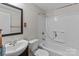 The bathroom features a sink, toilet, and shower/tub combo at 94 Sumner Nw Ave, Concord, NC 28027