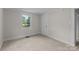 This carpeted bedroom features a window that offers natural lighting at 94 Sumner Nw Ave, Concord, NC 28027