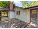 View of the side and back of a house featuring a deck, windows, chimney and yard at 94 Sumner Nw Ave, Concord, NC 28027