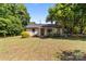 Charming single-story home with mature trees, well-maintained lawn, and inviting front entrance at 94 Sumner Nw Ave, Concord, NC 28027