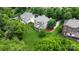 Aerial view of sprawling home with lush landscaping, a large backyard, and a private patio at 9433 Wallace Pond Dr, Huntersville, NC 28078