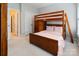 bedroom with a wood bunkbed and neutral carpeting at 9433 Wallace Pond Dr, Huntersville, NC 28078