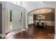 Elegant foyer with hardwood floors, natural light, and views into the dining room at 9433 Wallace Pond Dr, Huntersville, NC 28078