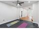 Light and airy home gym with yoga mats, free weights, and plenty of space for a full workout at 9433 Wallace Pond Dr, Huntersville, NC 28078