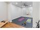 Bright home gym with rubber flooring, mirrors, and exercise equipment for a complete fitness routine at 9433 Wallace Pond Dr, Huntersville, NC 28078