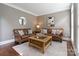 Cozy living room featuring leather sofas, a decorative rug, and neutral wall paint at 9433 Wallace Pond Dr, Huntersville, NC 28078