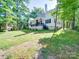 Spacious backyard with lush landscaping, enhancing the home's outdoor appeal at 9712 Worley Dr, Charlotte, NC 28215