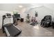 Multi purpose bonus room with treadmill, massage chair, and workstation at 9712 Worley Dr, Charlotte, NC 28215