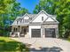 Charming two-story home with a welcoming front porch and a two-car garage at 9712 Worley Dr, Charlotte, NC 28215