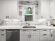 Modern kitchen featuring new sink, stainless dishwasher, and marble backsplash and counter tops at 9712 Worley Dr, Charlotte, NC 28215