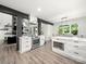 Open-concept kitchen with stainless steel oven, kitchen island, and adjacent dining area at 9712 Worley Dr, Charlotte, NC 28215