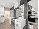 Bright kitchen featuring white cabinets, stainless steel appliances, and an open concept layout at 9712 Worley Dr, Charlotte, NC 28215