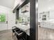 Stylish kitchen featuring a kitchen island with seating and stainless steel appliances at 9712 Worley Dr, Charlotte, NC 28215