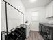 Well-lit laundry room with front load machines, counter space, storage cabinets, and dark gray floors at 9712 Worley Dr, Charlotte, NC 28215
