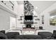 Spacious living room with fireplace, vaulted ceiling, and lots of natural light at 9712 Worley Dr, Charlotte, NC 28215