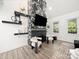Bright living room with stone fireplace and lots of natural light at 9712 Worley Dr, Charlotte, NC 28215