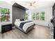 Inviting main bedroom with unique design elements and ample natural light from large windows at 9712 Worley Dr, Charlotte, NC 28215