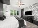 Comfortable main bedroom featuring a ceiling fan and large windows with natural light at 9712 Worley Dr, Charlotte, NC 28215