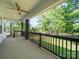 Spacious covered porch featuring views of the lush backyard greenery at 9712 Worley Dr, Charlotte, NC 28215